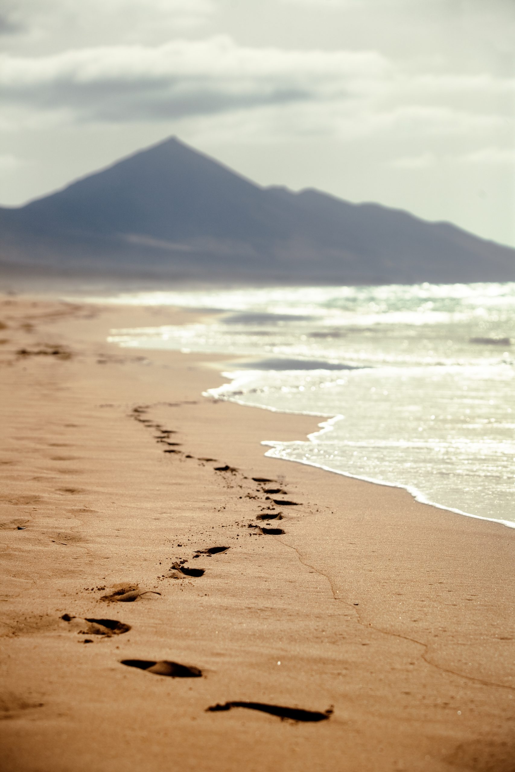 Footprints Sandy Beach With Mountain Background Canary Islands Spain Scaled